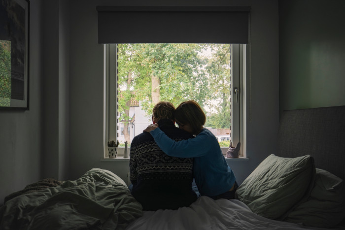 Doctor discussing alcohol and male sexual performance with patient during counseling