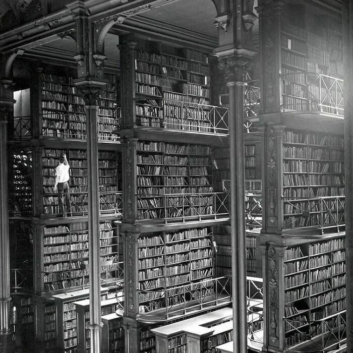 "A Man Browses For Books In The Old Public Library Of Cincinnati. The Building Was Demolished In 1955. Today An Office Building And A Parking Lot Stand Where It Used To Be"