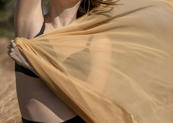 9. The sarong is your travel wardrobe’s MVP. Wear it, sit on it, or cover up with it—it does it all!