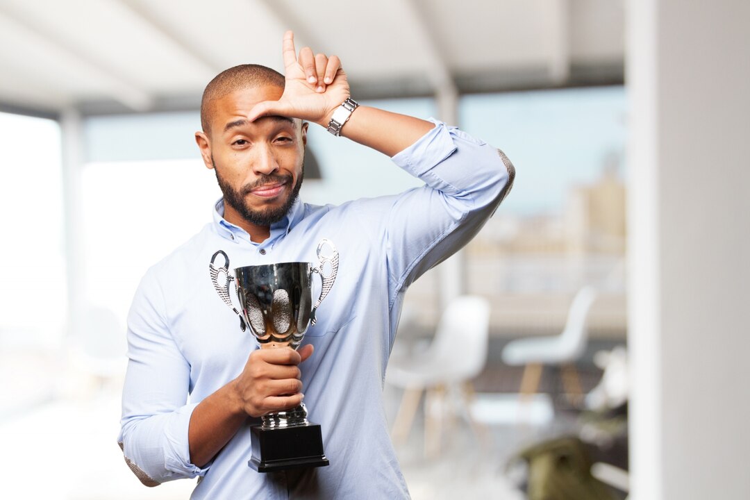 6. Downplaying accomplishments or personal wins