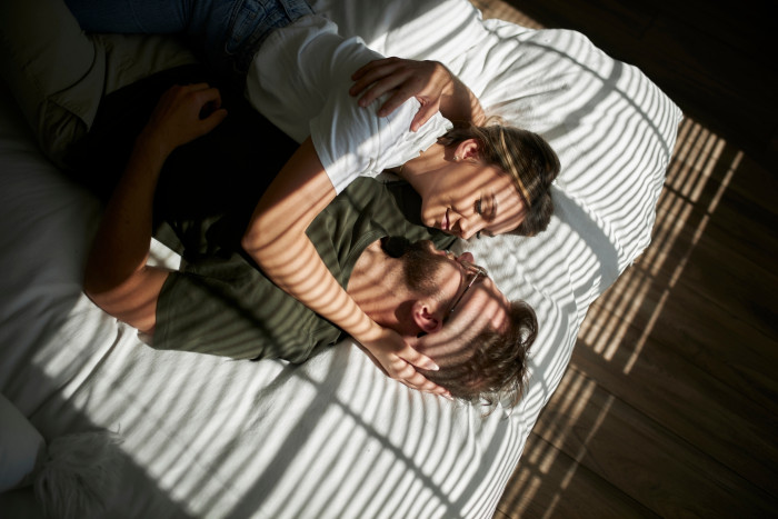 Couple sitting together at home, discussing relationship satisfaction and intimacy quality
