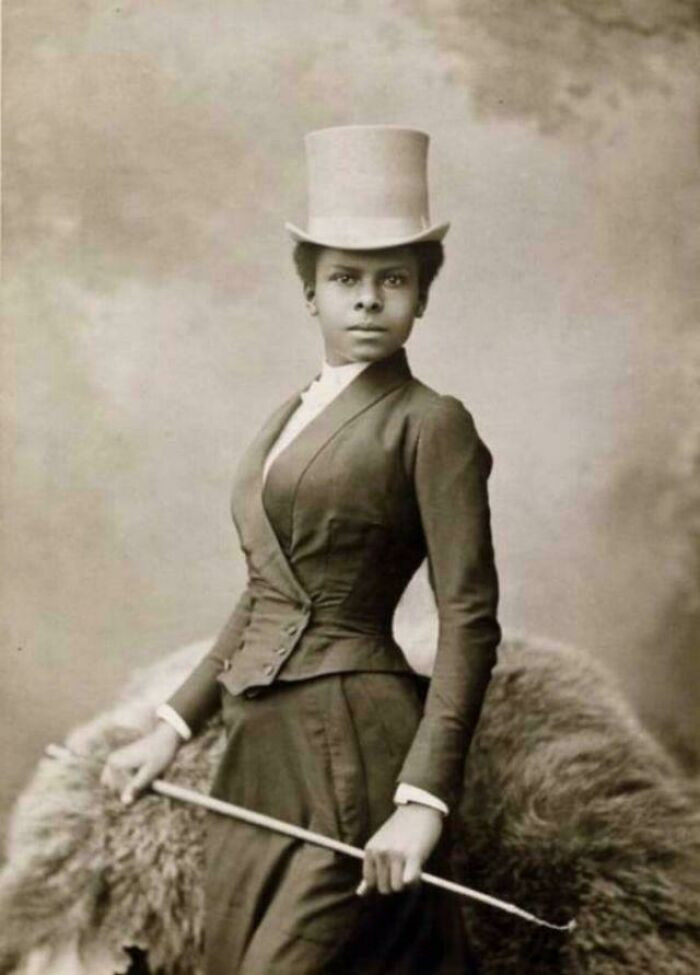 "Woman Poses In What Looks Is A Riding Outfit. Like The Double Breasted Low Cut Jacket. Late XIX Century"