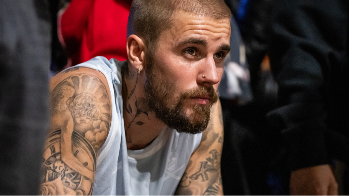 Justin Bieber speaking at an event, reflecting on faith and mental health