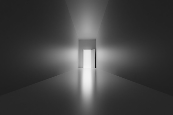 Person reflecting on surreal near-death impressions, exploring vivid spiritual experiences