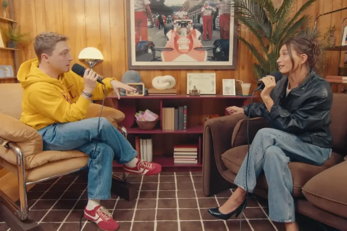 Hailey Bieber smiling while discussing motherhood and her family with Justin