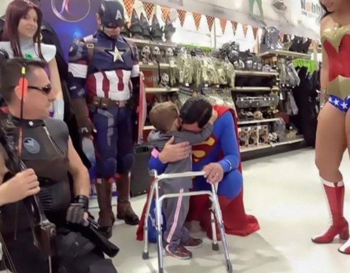 19. There was a group of characters dressed as superheroes at a local costume shop.