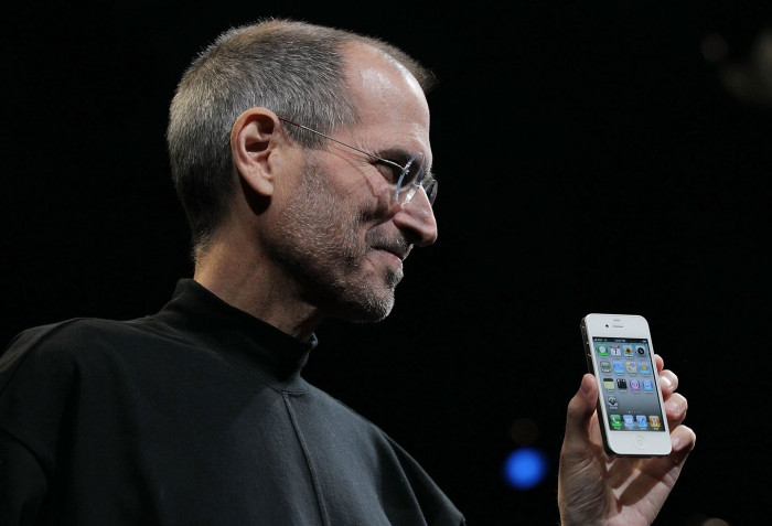 Steve Jobs speaking at an Apple presentation, symbolizing innovation and connection