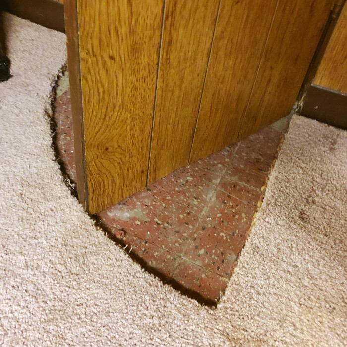 12. Why cut the door when you can cut the carpet instead? (Found in the new house basement.)