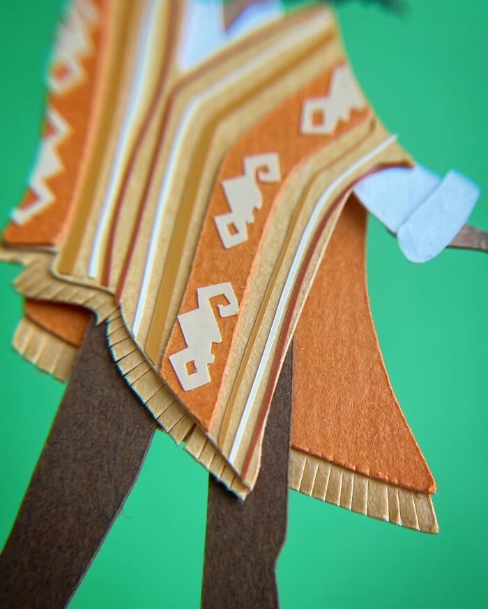 Camilo Madrigal's poncho features intricate patterns and vibrant colors.