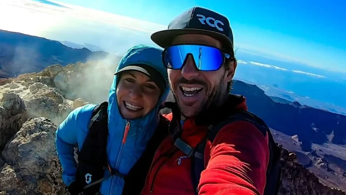 Mountain summit at dusk, climbers’ gear near a tragic accident scene