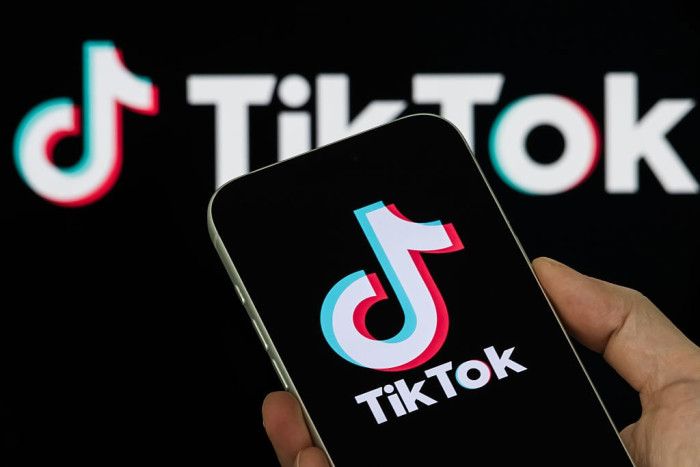 People uninstall TikTok on smartphones amid concerns over updated privacy terms.