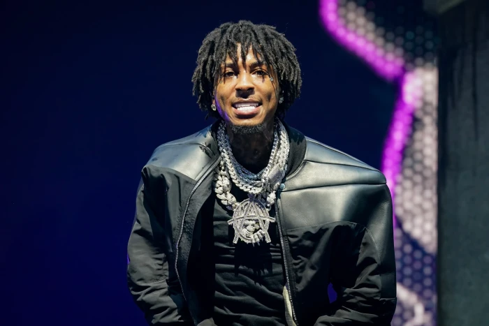 YoungBoy rapper portrait discussing fame and fatherhood in hip-hop journey