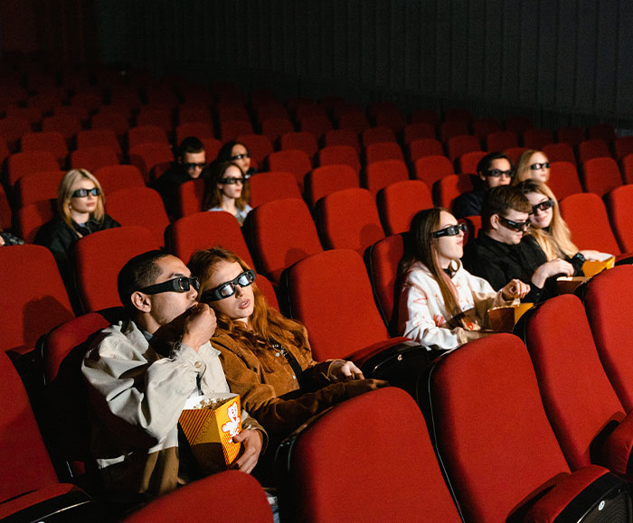 Boss catches employee at the movies.