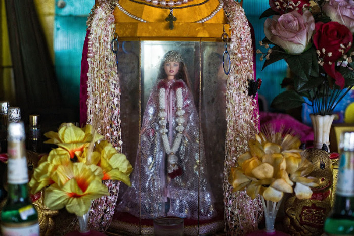 Pulau Ubin Barbie (Singapore): a Barbie enshrined in a memorial temple, tied to a WWI-era legend of a German girl's death, now treated as a benevolent local deity