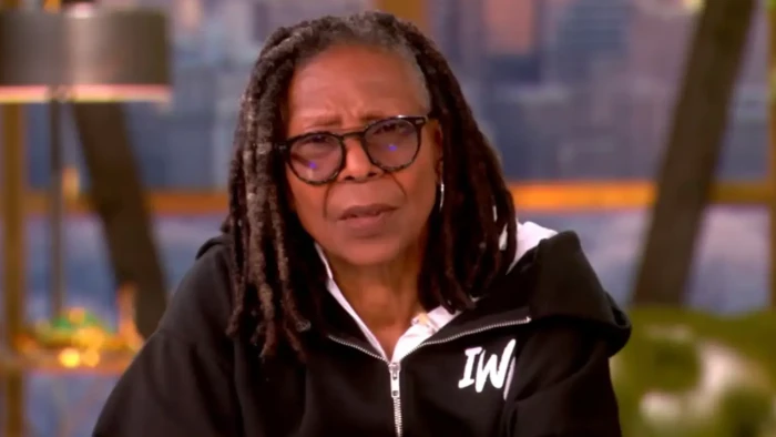 Whoopi Goldberg speaks at an event, addressing rumors about Jeffrey Epstein link