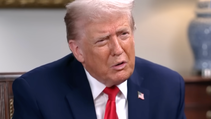 Donald Trump speaking at a press conference, outlining Iran response directives