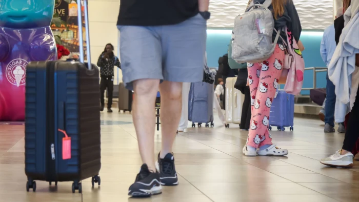Signboard at Tampa airport announcing new dress code, banning pajamas