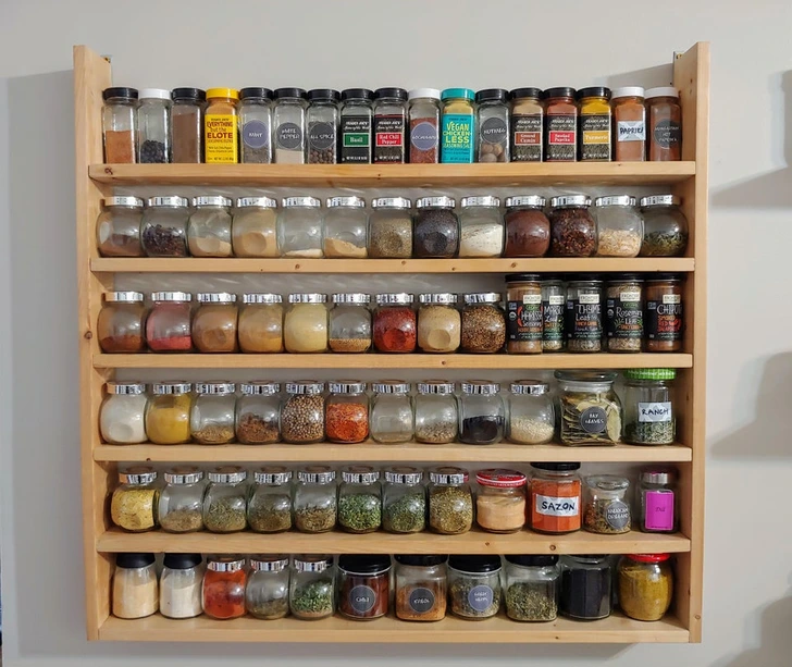 9. “No more paying for an expensive spice shelf. Instead, my boyfriend made this from old bed slats.”