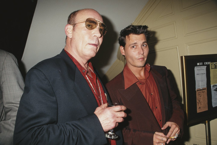 Hunter S. Thompson styled like a chaotic writer, exaggerated disdain and absurdity.