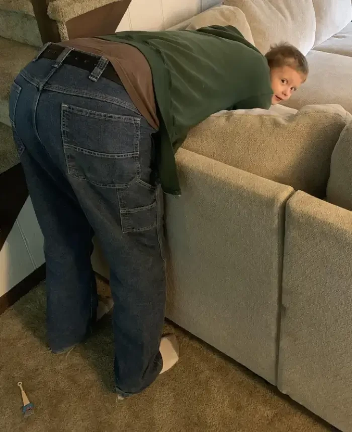 16. This is a man hugging his grandchild.