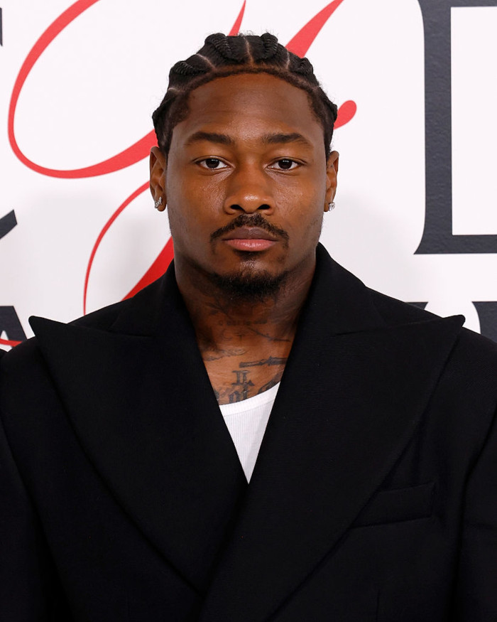 Stefon Diggs in New England Patriots gear during public appearance amid allegations