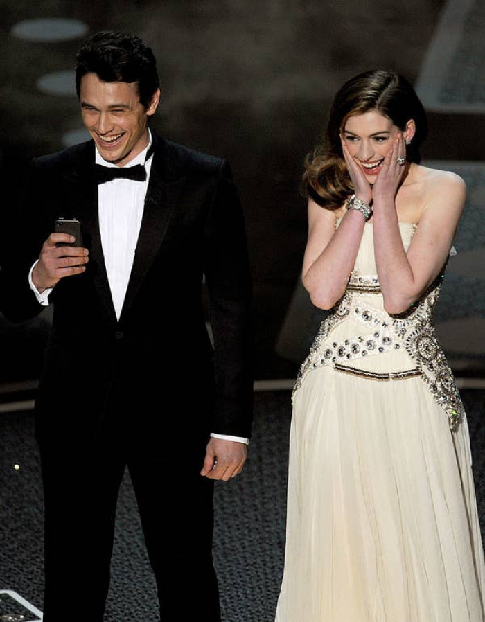 While Hathaway hasn't specified an embarrassing acting role, she was embarrassed co-hosting the Oscars in 2011