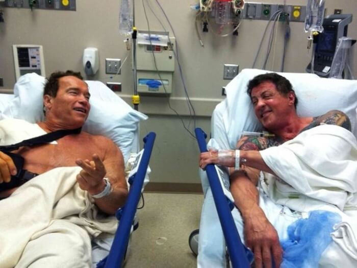 8. Here are the two bed buddies, Arnold Schwarzenegger and Sylvester Stallone