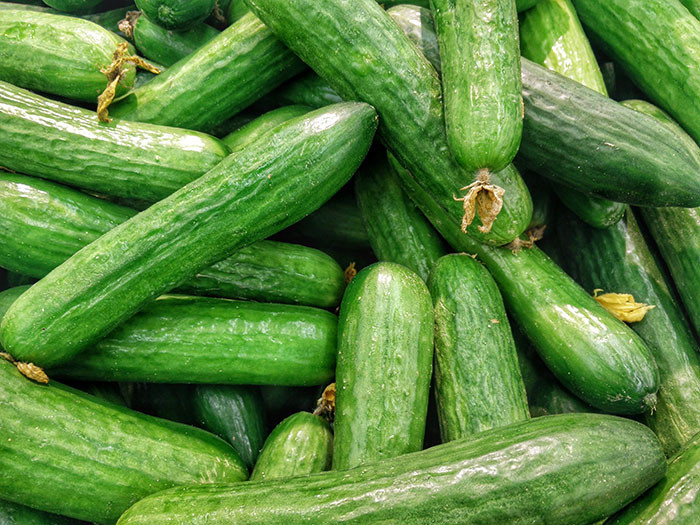 As cucumbers contain seeds at their center, they are classified as fruits rather than vegetables.