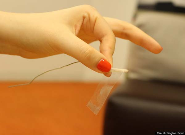 Roll the tape around the paperclip.