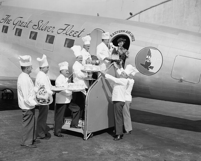 "Air Travelers Leaving Washington Airport During National Air Travel Week Are Being Given Cakes, Washington, D. C., 1938"