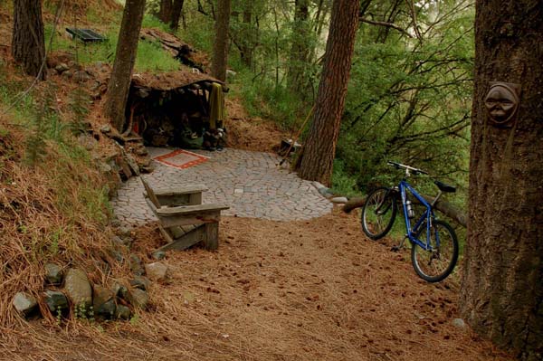 This humble door leads to the charming hobbit hole of Dan Price, also called the Hobo Artist.