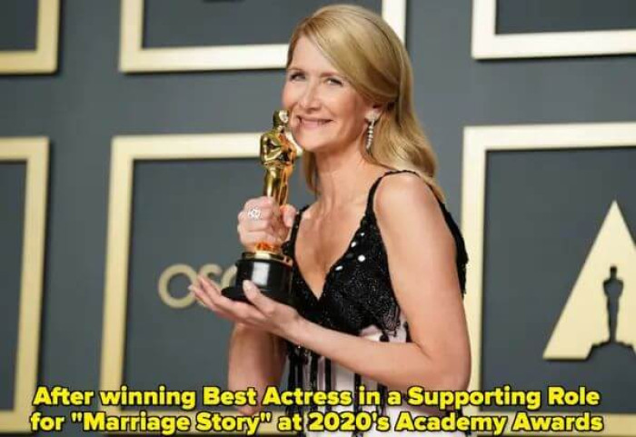 Dern posing with her award at the 2020 Academy Awards