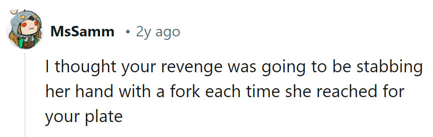 Stabbing? Nah, just a gentle reminder to keep hands off her plate. Forks can be persuasive!