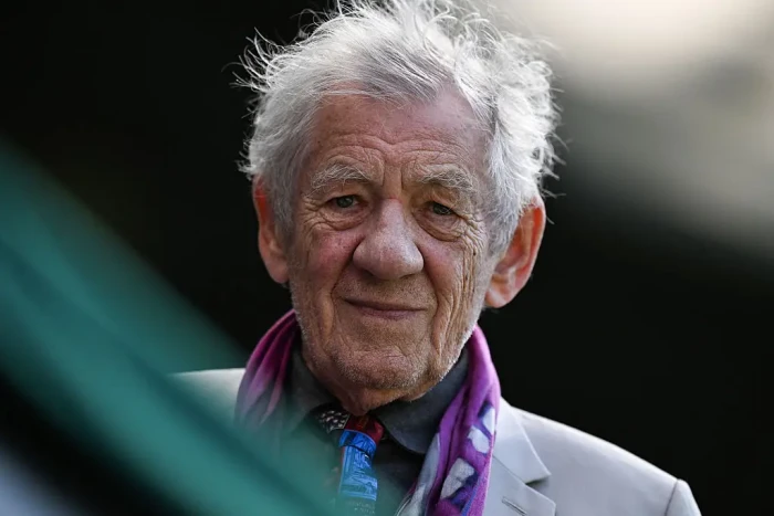 Ian McKellen smiling on stage, energized and discussing his acting legacy