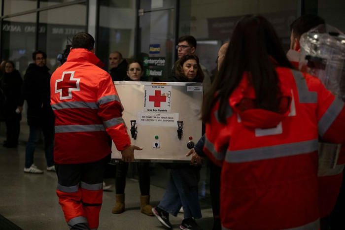 Emergency rescue teams work at Córdoba high-speed train derailment site at night