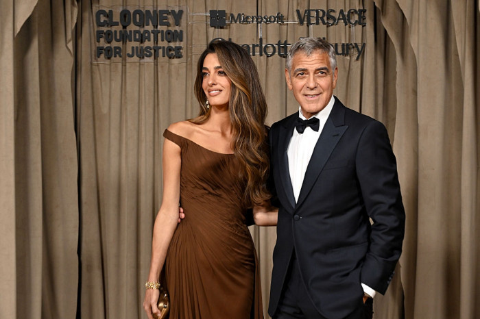 Clooney twins playing with Italian phrases, highlighting privacy away from US media.