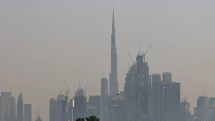 Airport departures board showing flight cancellations and delays during Middle East escalation