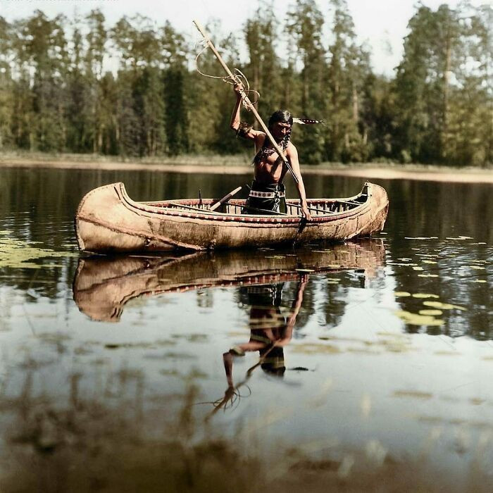 14. A Native American, Belonging To The Ojibwe People, Spear Fishing In A Lake Somewhere In Minnesota, United States. Photograph Taken In 1908