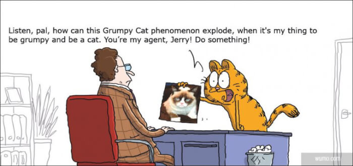 14. Garfield isn't too happy about Grumpy Cat taking over his role