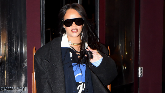 Rihanna and her bodyguard near a doorway, moment captured during mishap