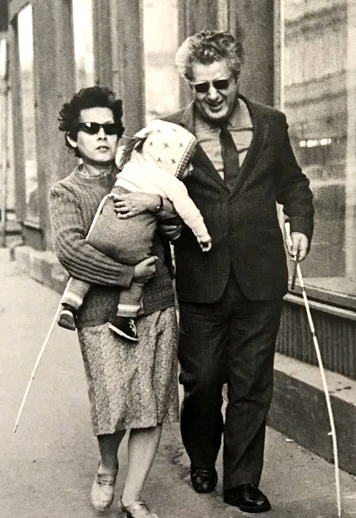 A Blind Couple Walking With Their Child In The Streets Of Budapest, 1984