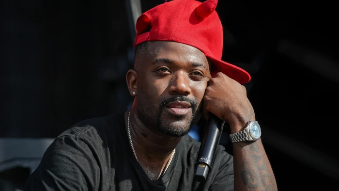 Ray J performing on stage, viewers notice red marks on his face