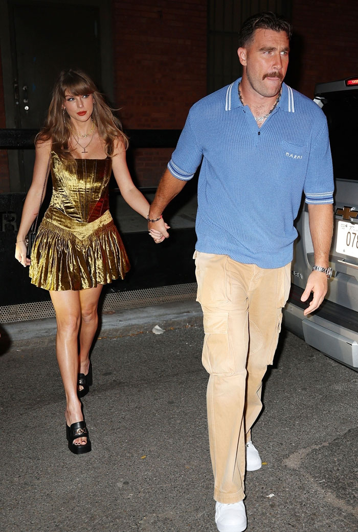 2. Swifties are on high alert after spotting a mysterious mark on Taylor’s arm. Was this date night too hot to handle?