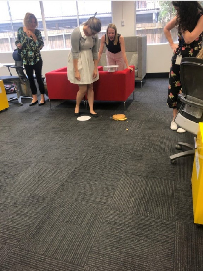 27. My wife's big moment presenting a birthday cake at work....