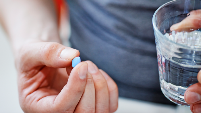 Healthcare setting with man and prostate cancer recovery materials, PDE5 inhibitors.