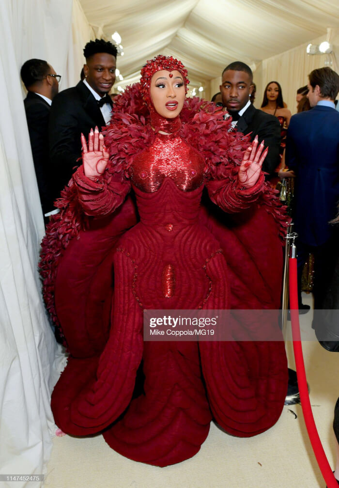 2. They say two heads are better than one, but Cardi B’s dress needed 10.