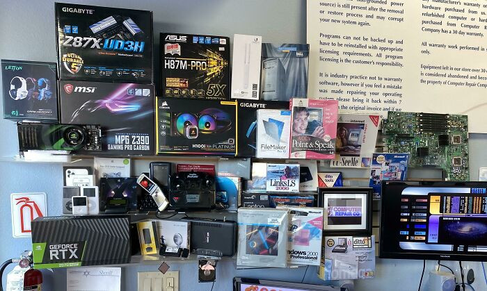 "My Wall Of New And Old 90’s Tech. Cu-See-Me In Original Retail Box. Aol Point & Speak By Dragon Systems. Palm And Motorola Beeper And Razr"
