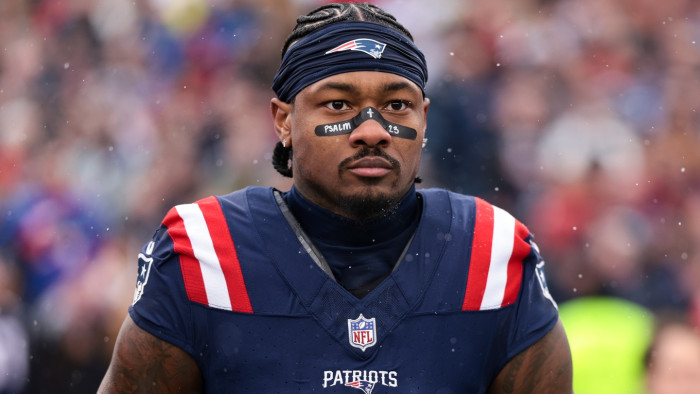 NFL player Stefon Diggs at press event, legal dispute over unpaid wages