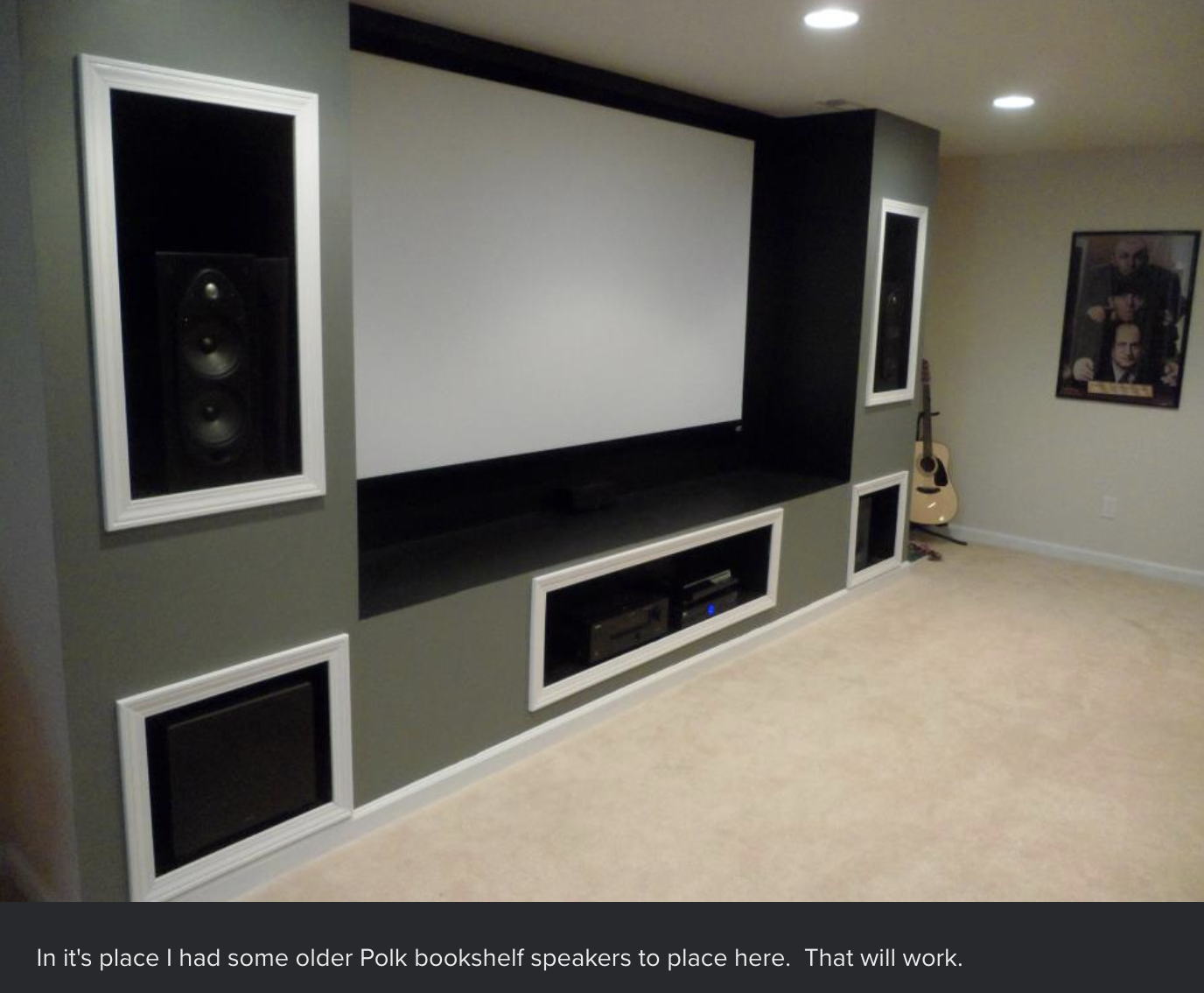 The speakers, screen, and subwoofers have been installed. It also looks like OP put cornices on the shelves to frame the equipment better.