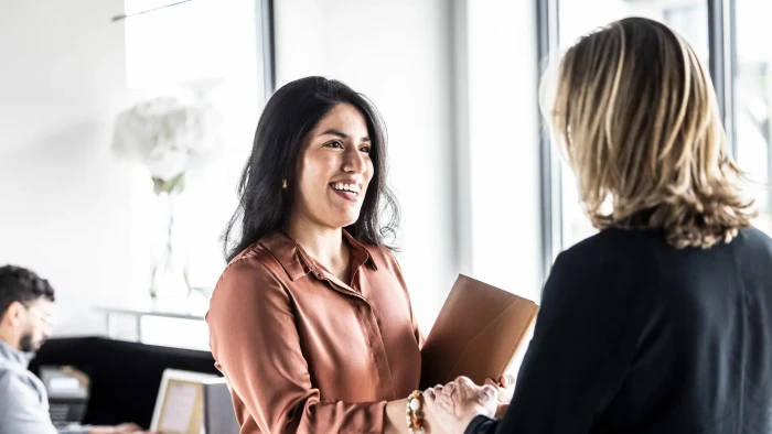 New employee demonstrating commitment at desk, preparing for first-day responsibilities